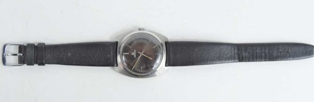 A vintage Zenith gentleman's wristwatch, the black dial with baton numerals, leather strap.
