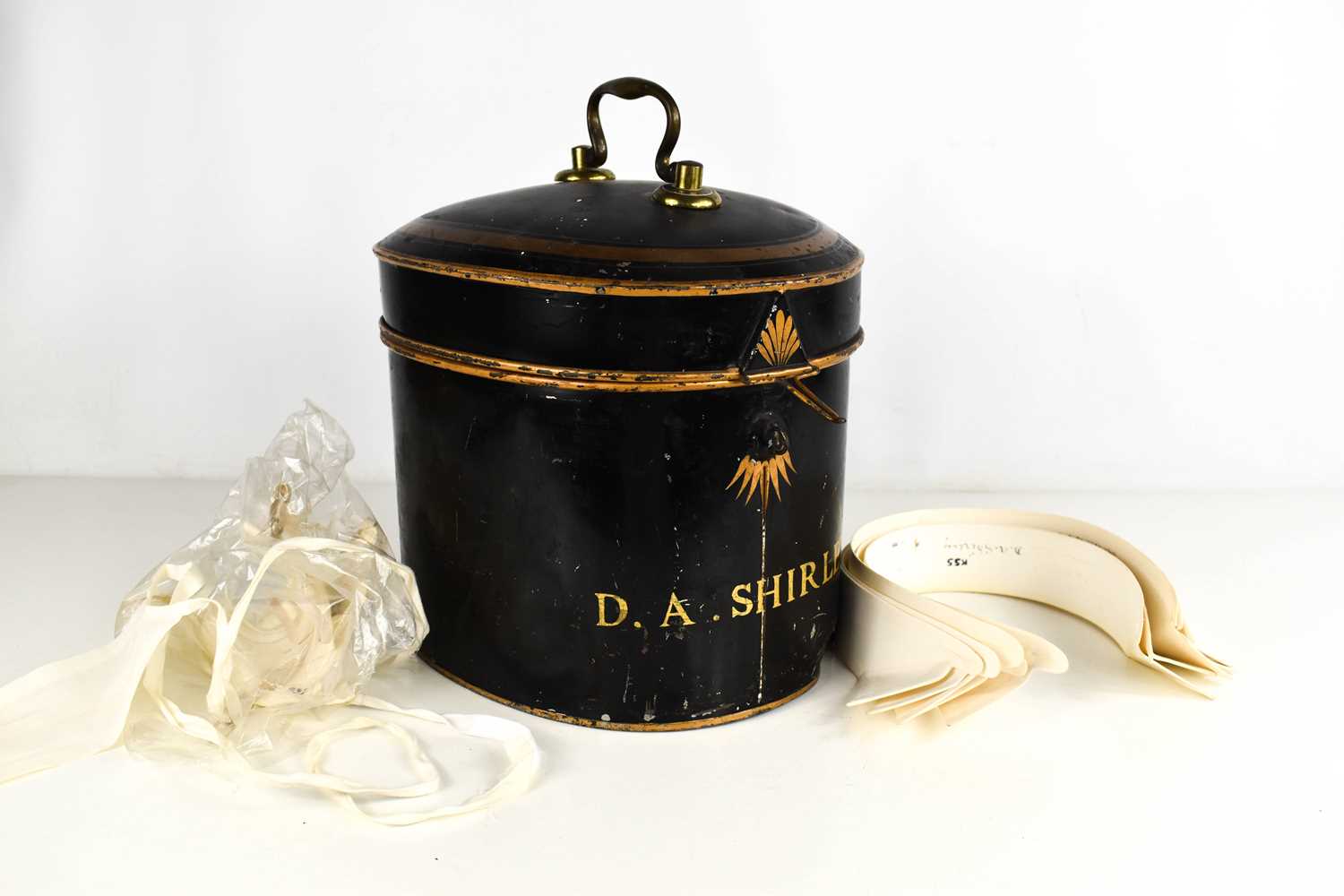 An antique barristers wig and original display tin, by Ravenscroft Law, Wig & Robe Makers,