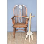 A yew and elm wood Windsor chair with bent wood top-rail and arm rests, linked by a pierced splat