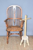 A yew and elm wood Windsor chair with bent wood top-rail and arm rests, linked by a pierced splat