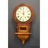 A 19th century walnut and mahogany cased drop dial wall clock with foliate carving, with pendulum