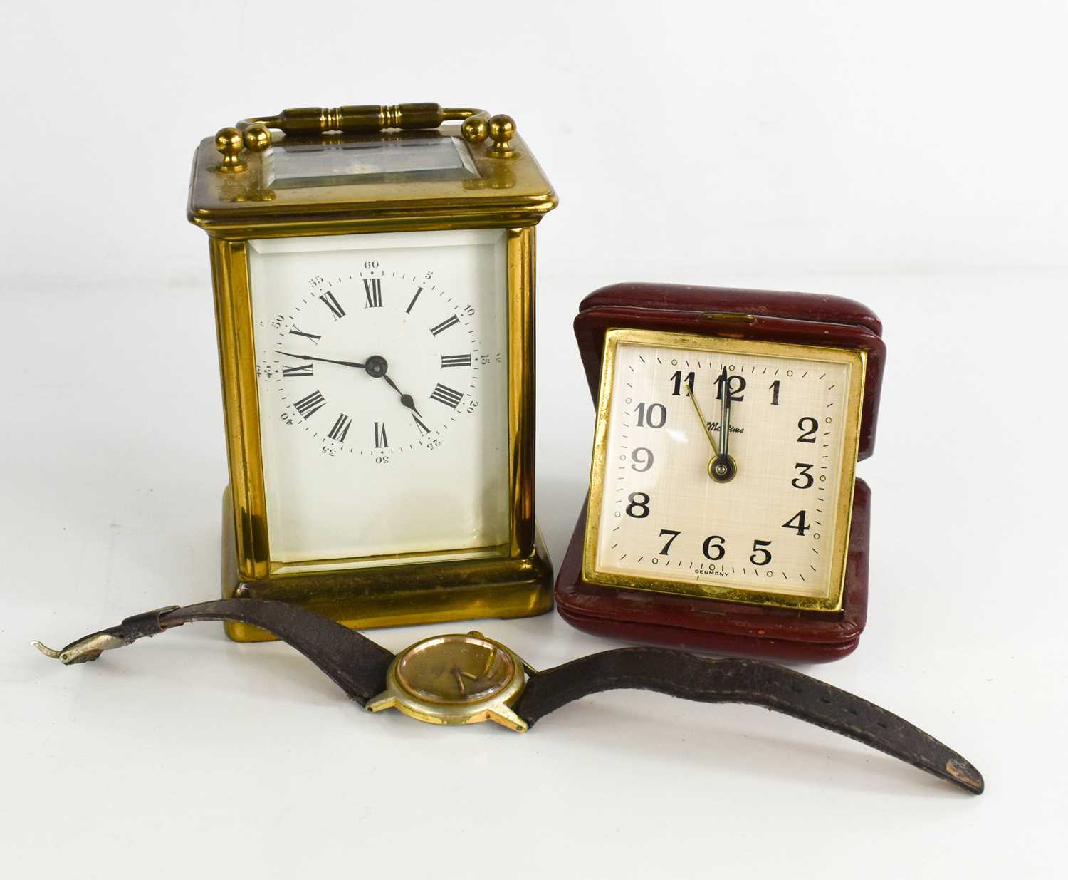 A French brass carriage clock with single train movement, Roman numeral dial, 11cm high, together