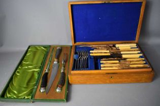 An oak cased canteen of cutlery together with a vintage carving set in the original presentation