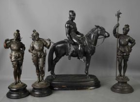 A set of three metalware medieval style soldiers, together with a sculpture of soldier on horseback.