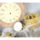 A group of clock parts to include a brass mantle clock case, a fusse movement, clock dials,