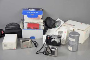 Three Leica cameras comprising of digilux 4.3, digilux 1 and a digilux zoom with original box, a