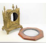 A 19th century Gothic Revival mantle clock case, the gilt metal with central circular aperture,