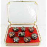 A collection of eight Franklin Mint porcelain musical boxes depicting Russian ballet inside a