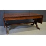 A mahogany sofa table / coffee table, 42cm high by 104cm when extended by 53cm.