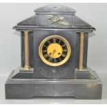 A 19th century French slate 8 day mantle clock, enamel and brass dial with Roman numerals, with