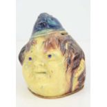 A Victorian lead glazed money box in form of a smiling policeman, 12cm high.