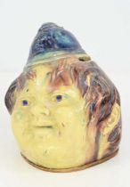 A Victorian lead glazed money box in form of a smiling policeman, 12cm high.