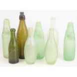 Local Interest: A group of glass bottles to include Stamford and Oundle examples.