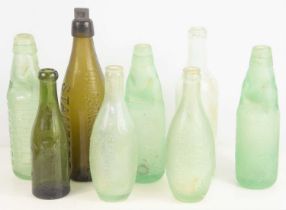 Local Interest: A group of glass bottles to include Stamford and Oundle examples.
