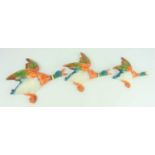 A Set of Three Beswick Flying Duck Wall Plaques the largest measuring 26cm by 25cm.
