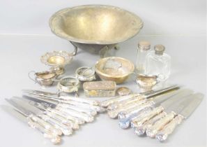 A group of Cooper Brothers silver handled table and dessert knives together with two bottles with