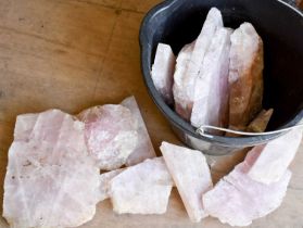 A selection of rose quartz in various shaped sections.