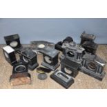 A large group of slate clock cases of various different styles.