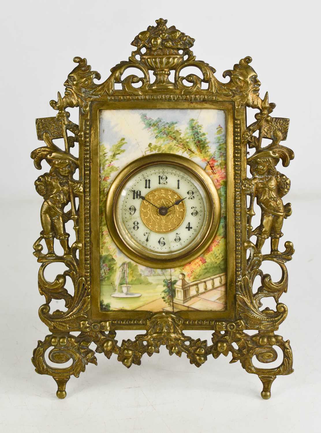 A French brass and porcelain table clock, the Arabic dial set within a porcelain plaque painted with