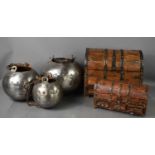 Two medieval style domed iron clad caskets, together with three steel medieval style jars with