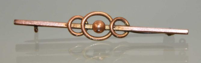 A 9ct gold bar brooch of triple loop design, with beaded centre, approximately 56mm long, 1.98g.
