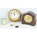 A brass circular bulkhead clock, a Bakelite Smiths clock and a small painted Kienzle clock.
