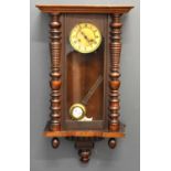 An early 20th century mahogany Vienna style wall clock, Roman numeral dial.