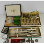 A silver bangle, together with various flatware including an Art Deco carving set, butter knives,
