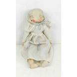 A vintage bisqe headed three faced doll, with linen body and bisqe hands and feet, the three faces