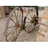 A large pair of LR Knapp & Co of Faringdon, The Monarch iron cart wheels, and an axle, 137cms