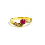 An 18ct gold, ruby and diamond ring, central pink stone of approximately 4.5mm diameter, flanked