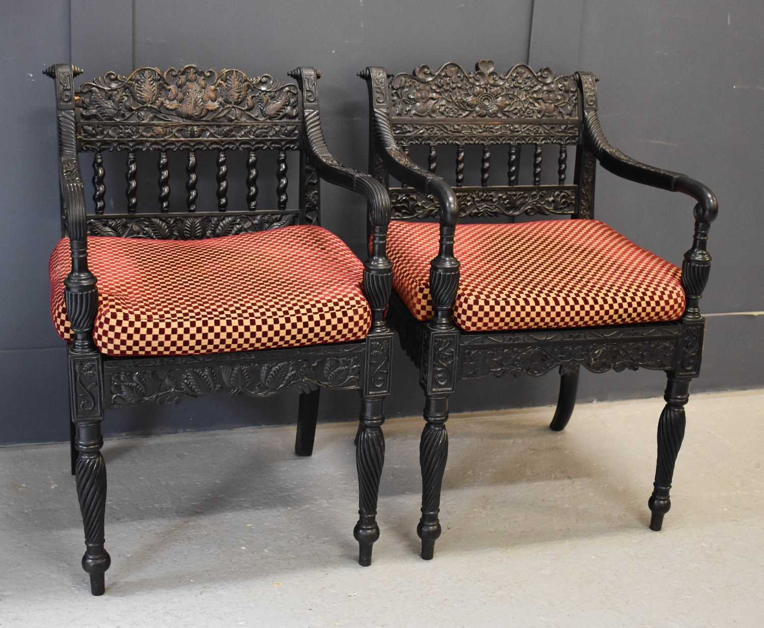 A pair of exeptional Anglo Indian ebony carved armchairs, circa 1840, Ceylonese, the shaped and - Image 2 of 9