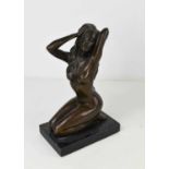 Milo bronze figure of a nude woman raised on slate base, 21cm high.