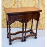 An 19th century oak tea / card table, the top folds out to rest on two folding front legs, with