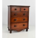 A Victorian mahogany apprentice piece chest of drawers, with bun feet, 29cm high.