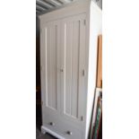 A John Lewis white painted wardrobe, with two doors and drawer below.