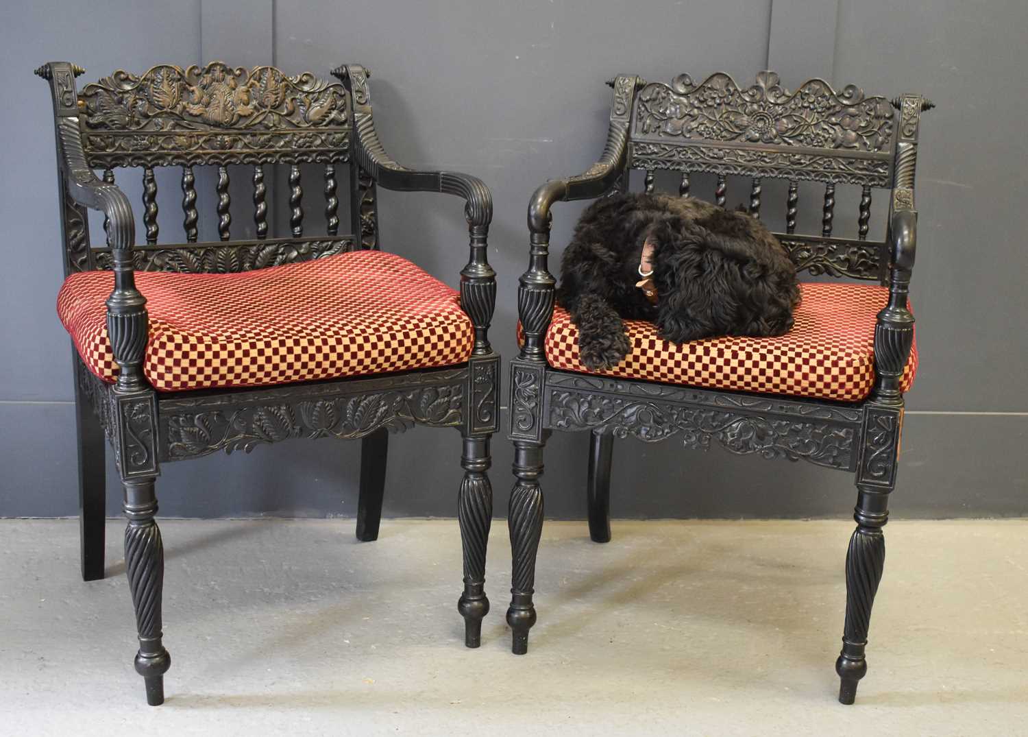 A pair of exeptional Anglo Indian ebony carved armchairs, circa 1840, Ceylonese, the shaped and - Image 3 of 9