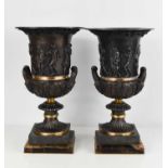 A pair of Campana bronzed metal cast urns, of classical style, depicting various figures to the