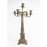A 19th century brass Empire style candelabra, with bronzed patination, having five candle sockets