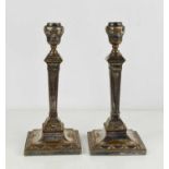 A pair of Regency period silver plated candlesticks, 27cm high, A/F.