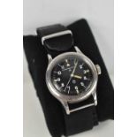 An International Watch Co. gentleman's military wrist-watch, the black signed dial with solid