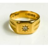 A gentleman's 18ct gold and diamond signet ring, the starburst set diamond of approximately 3mm