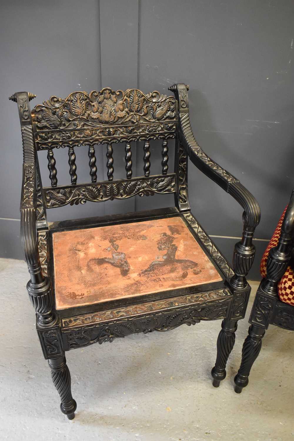 A pair of exeptional Anglo Indian ebony carved armchairs, circa 1840, Ceylonese, the shaped and - Image 5 of 9