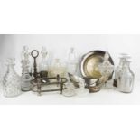 A selection of silver plate and glassware, to include bowl and covers, decanters, French oil and