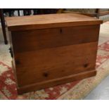 A small antique pine blanket chest/box with twin iron handles. 66cms long x 47cms deep x 47cms wide