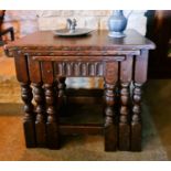 A nest of oak 18th century style tables, with nulled carved friezes.