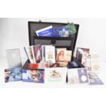 A collection of coins to include Royal Commemorative presentation packs, a variety of single Mint