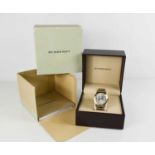 A Burberry wristwatch, with stainless steel strap, original box, instruction manual, Warranty