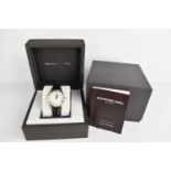 A Raymond Weil "Geneve" gentleman's wristwatch in the original box and booklet.