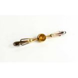 A 9ct gold, seed pearl and citrine bar brooch, unmarked but testing as 3.2g.